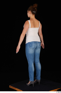 Serina Gomez blue jeans casual dressed grey high heels standing…